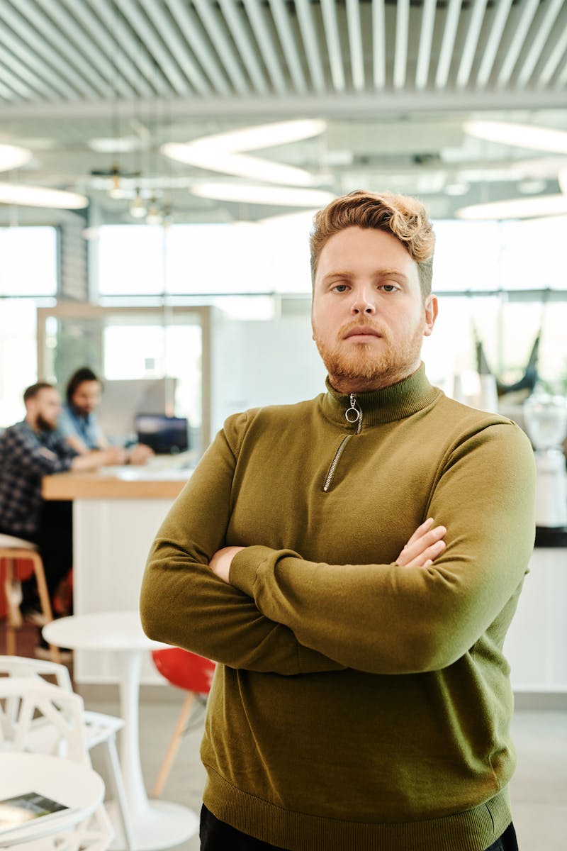 A Man Standing while Arms Crossed